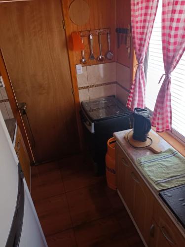 Una cocina o cocineta en Cabaña el ricky