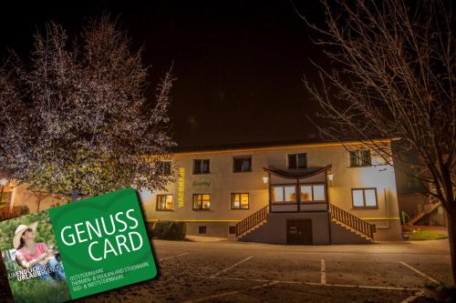 a campus card sign in front of a building at Gasthof Wachmann Ferienwohnung in Weiz