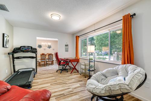 a living room with a couch and a table at Valrico Vacation Rental about 10 Mi to Dinosaur World! in Valrico
