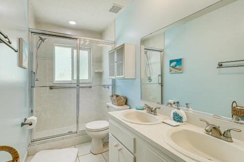 a bathroom with a sink and a toilet and a shower at Valrico Vacation Rental about 10 Mi to Dinosaur World! in Valrico