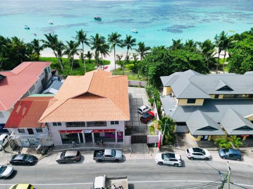 an aerial view of a city with cars parked in a parking lot at Shanaz Beachside Retreat in Anse Royale