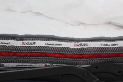 a close up of two sheets on a bed at The way to trieste bikes storage in Trieste