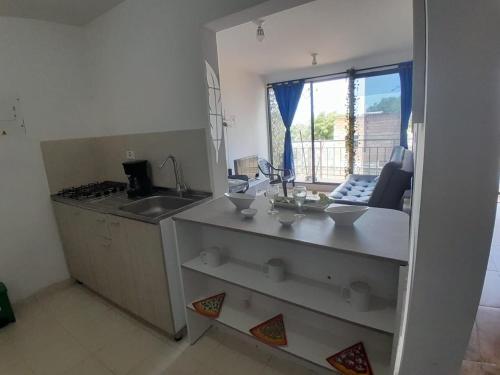a kitchen with a sink and a counter top at Portal de la Sierra Apto 207 in Playa Dormida