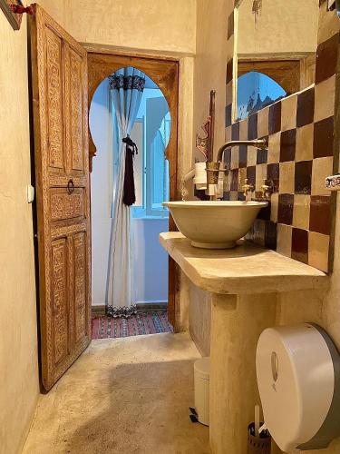 a bathroom with a sink and a toilet in it at Bab El Fen in Tangier