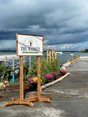 a sign for the marriott on a walkway near the water at Hotel Wolfe Island in Marysville