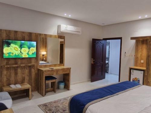 Postel nebo postele na pokoji v ubytování Maya Suits