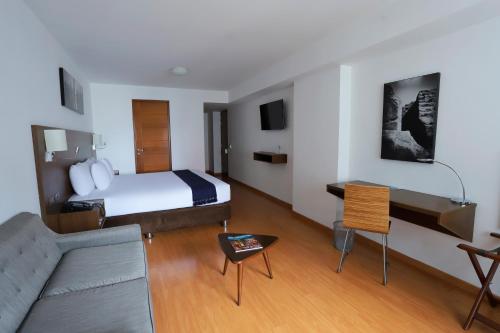 a hotel room with a bed and a couch at Casa Andina Select Miraflores in Lima