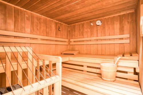 a cabin with a sauna with a staircase in it at Apart Fortuna in See