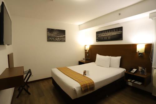 a hotel room with a bed and a television at Casa Andina Select Miraflores in Lima