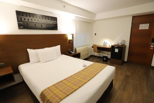 a hotel room with a bed and a desk at Casa Andina Select Miraflores in Lima