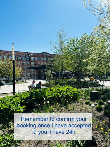 a sign that reads remember to confirm your booking once i have accepted it you at Centralt Lejlighed i Aalborg C - Budolfi in Aalborg