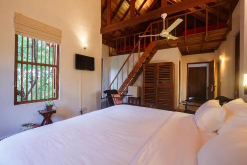 מיטה או מיטות בחדר ב-Lagoon House Rekawa