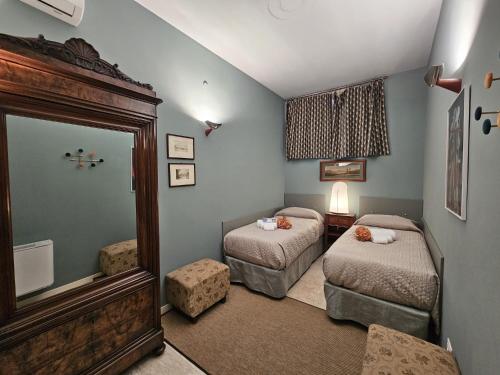 Llit o llits en una habitació de LOGGIA delle MERCANZIE