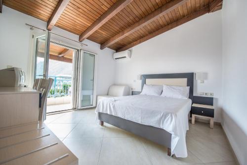 Postel nebo postele na pokoji v ubytování Hotel Dellis
