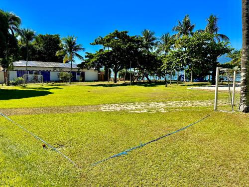 an open field with a soccer goal at Porto Grande Hotel & Convention in São Sebastião
