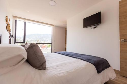 Postel nebo postele na pokoji v ubytování Alba Rooftop Suite