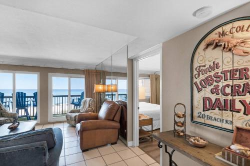 a living room with a view of the ocean at Pinnacle Port C1-302 in Carillon Beach