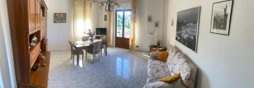 a living room with a couch and a table at La Collina in Riccò del Golfo di Spezia