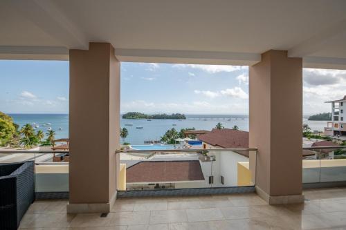 a view of the ocean from the balcony of a house at Hacienda Samana Bay Hotel in Santa Bárbara de Samaná