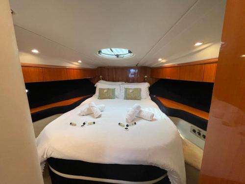 a large bed in the back of a boat at Motor Boat Accommodation in Torquay