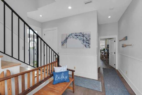 a hallway with a wooden bench in a house at A Point of View in Seagrove Beach