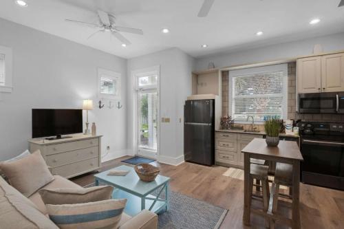 a kitchen and living room with a couch and a table at A Point of View in Seagrove Beach