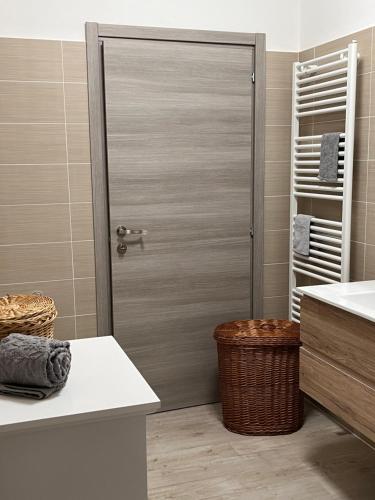 a bathroom with a shower with a sliding door at Casa Mario in Riva del Garda
