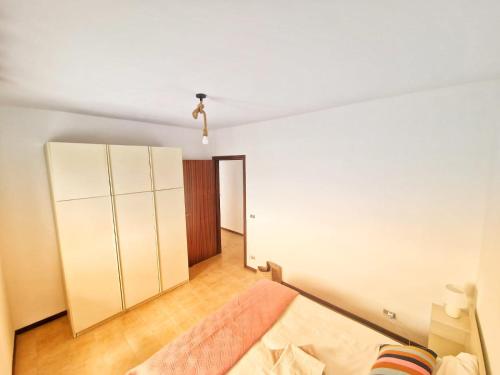 Ένα ή περισσότερα κρεβάτια σε δωμάτιο στο Relaxing italian seaside apartment
