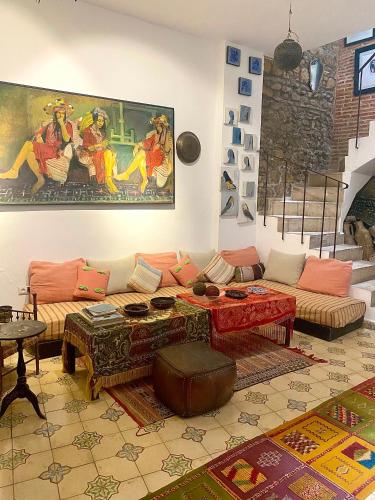a living room with a couch and a table at Bab El Fen in Tangier