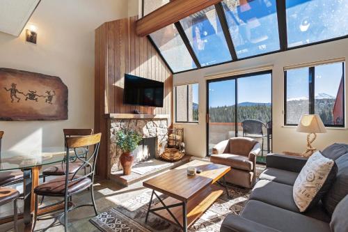 a living room with a lot of windows at Beaver Run Resort 34330 by Great Western Lodging in Breckenridge