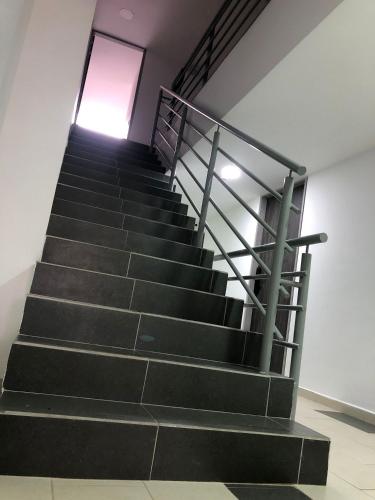 a staircase in a building with a light on it at Apartamentos cómodos en Milan zona G in Manizales