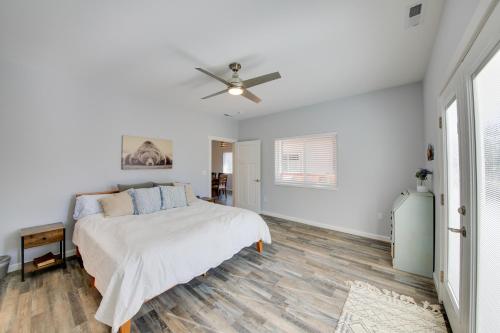 a white bedroom with a bed and a ceiling fan at Sandpoint Haven Less Than 3 Mi to Lake Pend Oreille! in Ponderay