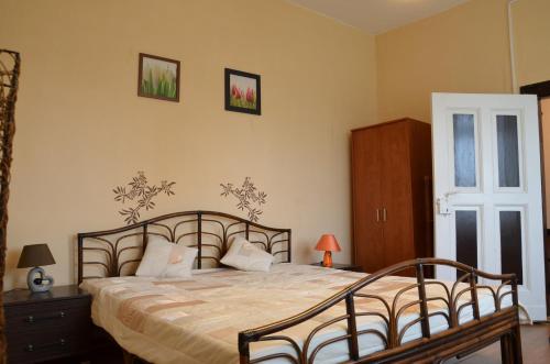 a bedroom with a large bed and a window at Stara Pastorówka in Dąbki