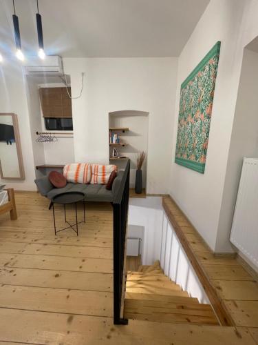 a living room with a couch and a table at Sebastian`s stylish apartment in old town in Tbilisi City