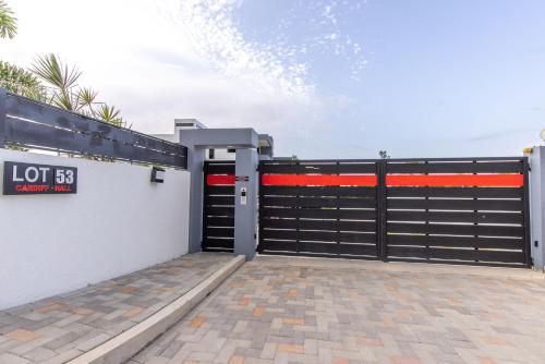 a black garage door with a sign on it at Royale Escape in Cardiff Hall