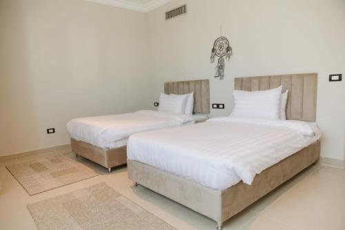 Postel nebo postele na pokoji v ubytování TK Royal & Spa