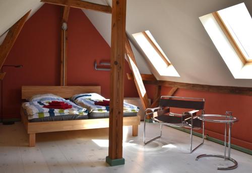 a bedroom with a bunk bed and skylights at Forsthaus Lelkendorf / Ferienwohnung in Lelkendorf