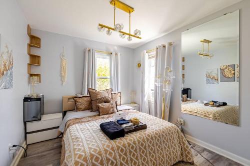 a bedroom with a large bed and a window at Elegant Serene Escape in Wyandotte in Wyandotte
