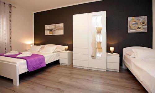 Кровать или кровати в номере Apartments Toni