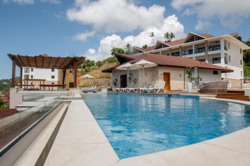 a view of the swimming pool of a resort at Hacienda Samana Bay Hotel in Santa Bárbara de Samaná
