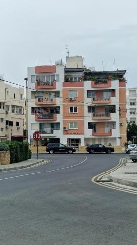 a stop sign in front of a large building at City Center Apartment 2 in Nicosia