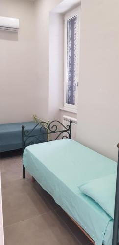 a hospital room with a bed and a window at GIOIA Holiday Home in Torre del Greco