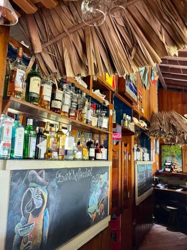 a bar with a sign on the counter of a restaurant at St. George's Caye Resort in Belize City