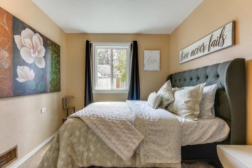 a bedroom with a bed and a window at Perfect for Families! Spokane Valley Home with Yard in Spokane Valley