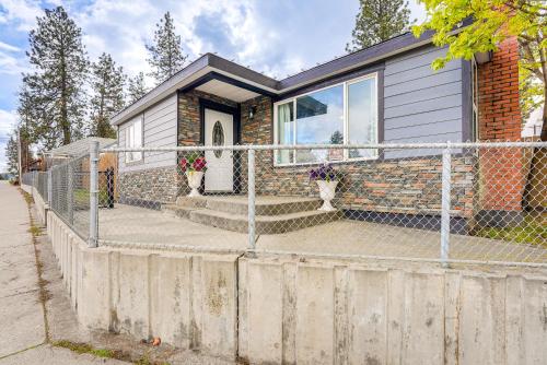 a house with a fence in front of it at Perfect for Families! Spokane Valley Home with Yard in Spokane Valley