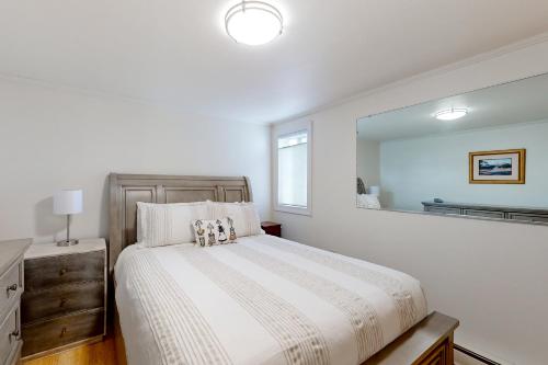 a bedroom with a bed and a large mirror at Tensleep A10 in Teton Village