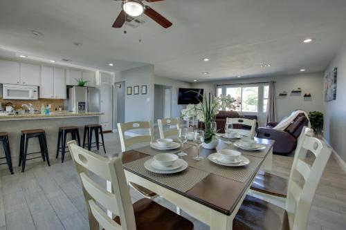 a dining room and living room with a table and chairs at Las Vegas Retreat with Yard Less Than 5 Mi to Strip! in Las Vegas