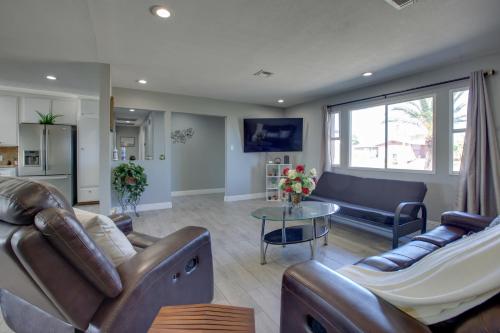 a living room with two couches and a table at Las Vegas Retreat with Yard Less Than 5 Mi to Strip! in Las Vegas