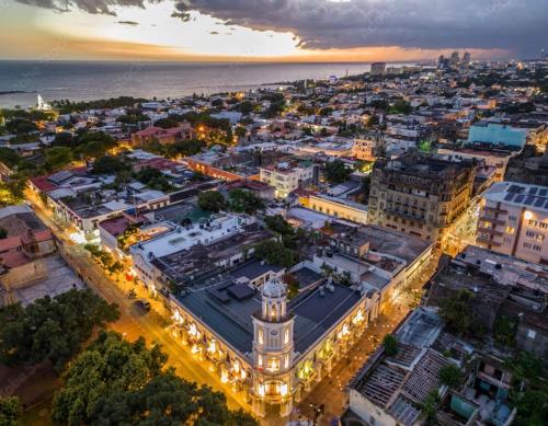 an aerial view of a city at night at hermosa casa en la zona colonial in Santo Domingo