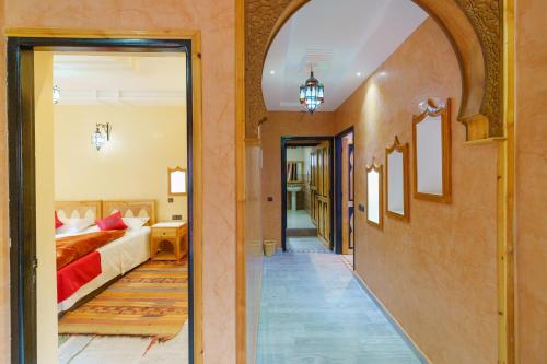 a hallway leading to a bedroom with a bed at Riad Tourtit in Imlil